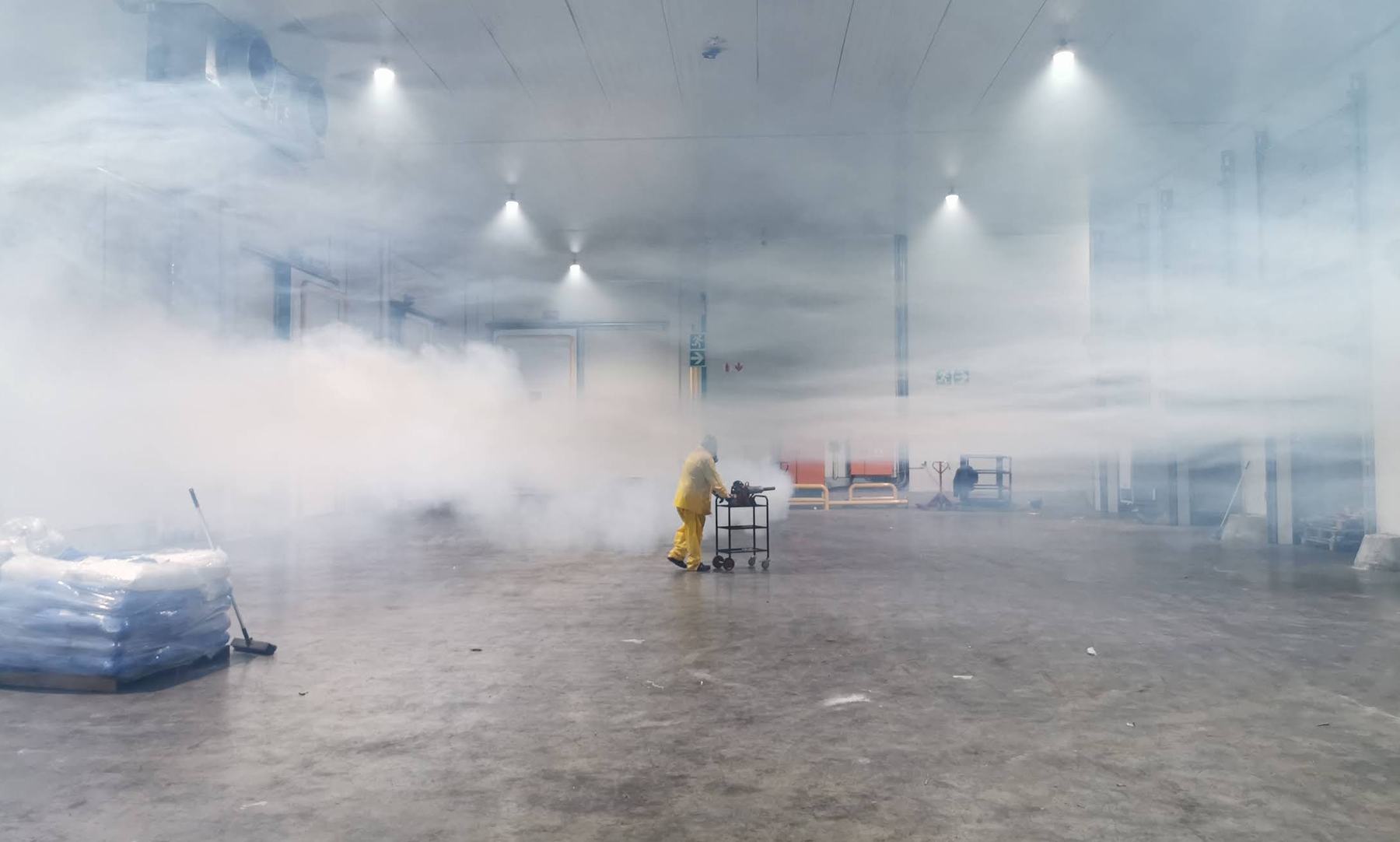 A Pest Guy technician fogging a large cold storage facility