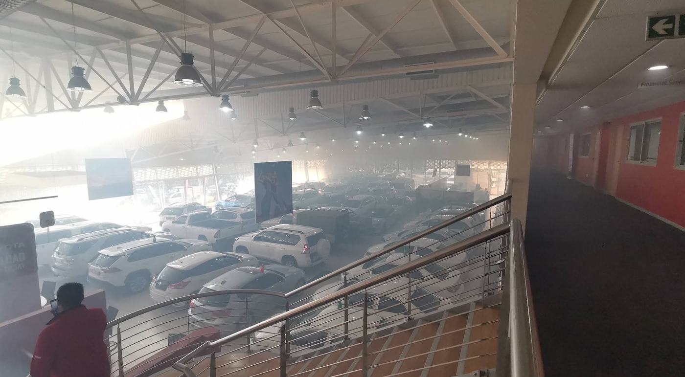 Fog treatment filling a car dealership showroom
