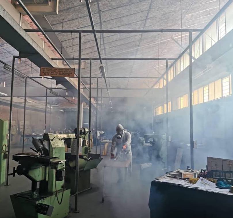 Engineering workshop with machinery during fogging